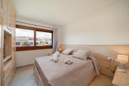 Postel nebo postele na pokoji v ubytování Rooms Tavolara