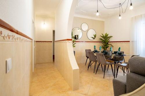 a dining room with a table and chairs at Milena's House in Nazaré