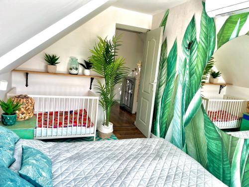 a bedroom with a bed and plants on the wall at Bohemian Eco Lodge at lake Balaton in Kisapáti