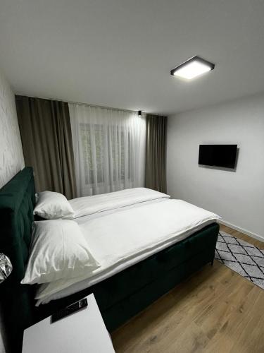 Ένα ή περισσότερα κρεβάτια σε δωμάτιο στο Apartman Kosuta Lux Garden