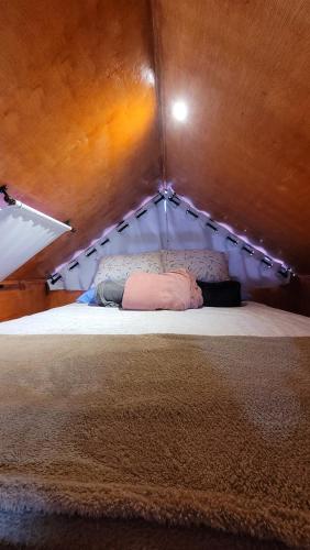מיטה או מיטות בחדר ב-Chale Henri Salvador
