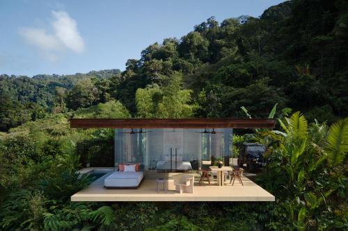 a house in the middle of a forest at ACHIOTÉ Architectural Gem - Adults Only in Uvita
