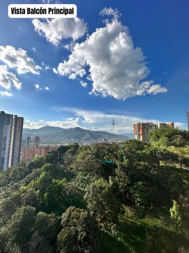 a view of a city with buildings and trees at Hermoso y Lujoso Apartamento en Sabaneta in Sabaneta