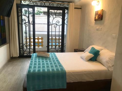Postel nebo postele na pokoji v ubytování HOTEL CASA BRESSE