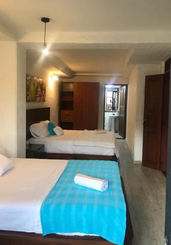 Postel nebo postele na pokoji v ubytování HOTEL CASA BRESSE