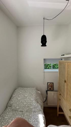 a bedroom with a bed and a window at bedandbreakfastrouveen in Rouveen
