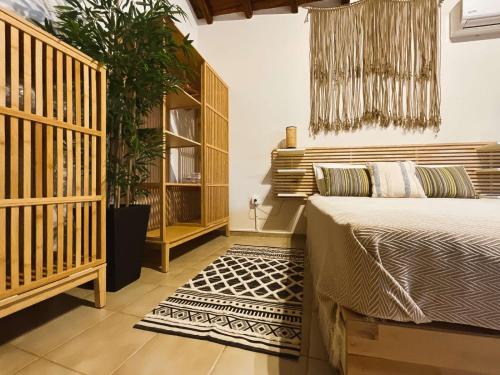 Ένα ή περισσότερα κρεβάτια σε δωμάτιο στο Spitaki Guest House