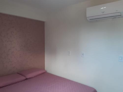 A bed or beds in a room at Apartamento 404 - Praia de Manaira