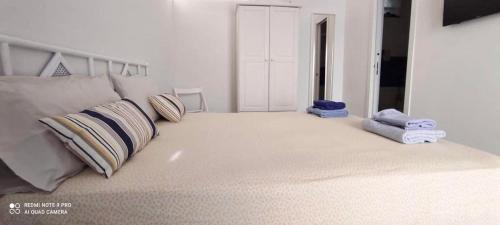 a bedroom with a bed with two pillows on it at Punta San Simone in Marettimo