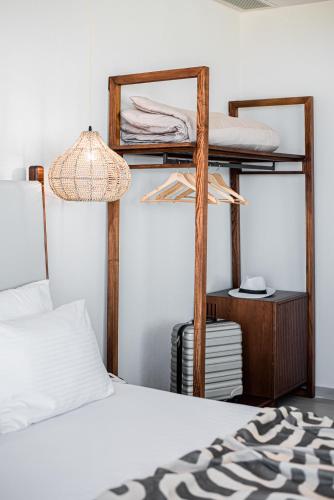 a bedroom with two bunk beds and a lamp at King's & Queen's Afitos - Suites With Private Pool in Afitos