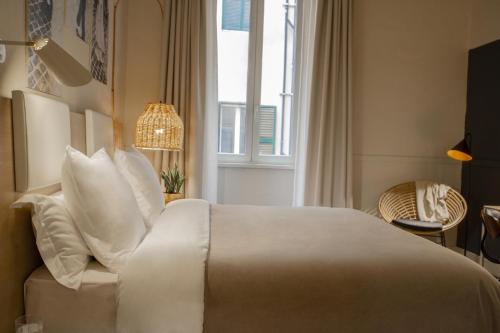 Ένα ή περισσότερα κρεβάτια σε δωμάτιο στο room Select Via Veneto