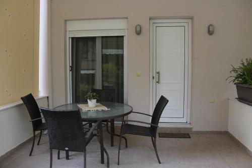 a dining room with a table and chairs at Thea Siviri in Siviri