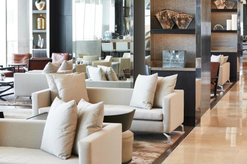 a lobby with couches and pillows in a store at AC Hotel by Marriott Santiago Cenco Costanera in Santiago