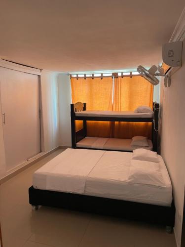 Postel nebo postele na pokoji v ubytování Alojamientos Cartagena Edificio Los Delfines