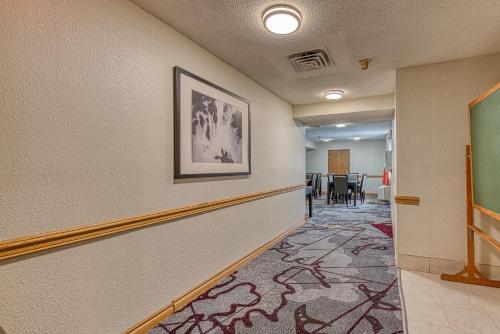 a corridor of a hallway with a hallway at American Inn & suites in Dundee