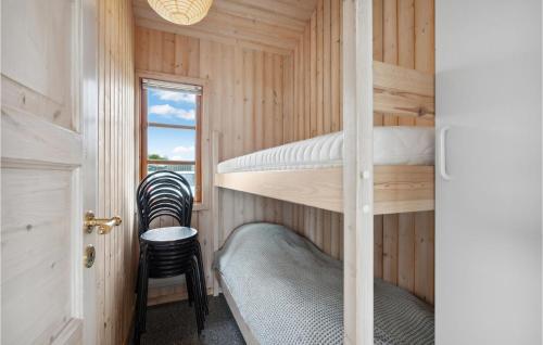 a small bedroom with bunk beds in a tiny house at Gorgeous Home In Esbjerg V With House Sea View in Esbjerg