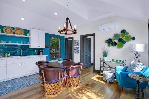 a kitchen with a table and a blue couch at Terlingua at the Bend in Wimberley