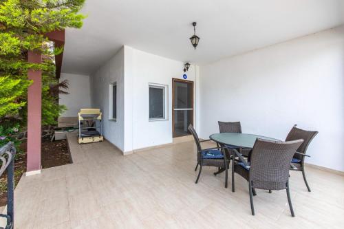 a dining room with a table and chairs at Sea View Duplex Private Villa in Bodrum Gundogan in Gundogan