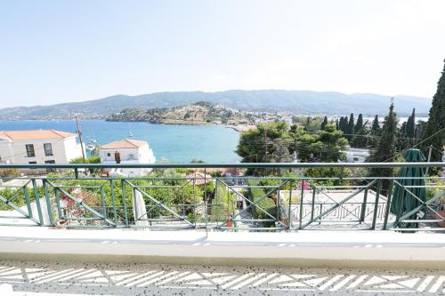 a view of the water from a balcony at Villa Sofia Sea View in Poros