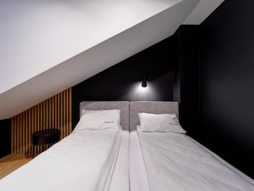 Ένα ή περισσότερα κρεβάτια σε δωμάτιο στο Stek Apartments ApartHotel