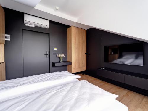 Ένα ή περισσότερα κρεβάτια σε δωμάτιο στο Stek Apartments ApartHotel