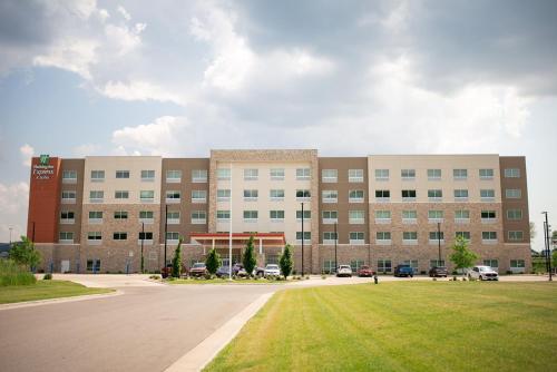 a large building with a lawn in front of it at Holiday Inn Express & Suites Onalaska - La Crosse Area by IHG in Onalaska