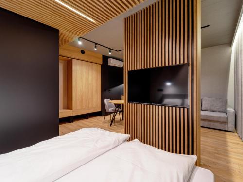 Ένα ή περισσότερα κρεβάτια σε δωμάτιο στο Stek Apartments ApartHotel