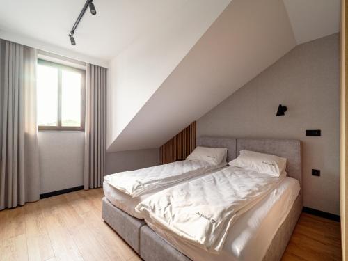 Ένα ή περισσότερα κρεβάτια σε δωμάτιο στο Stek Apartments ApartHotel