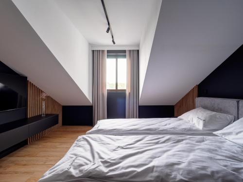Ένα ή περισσότερα κρεβάτια σε δωμάτιο στο Stek Apartments ApartHotel