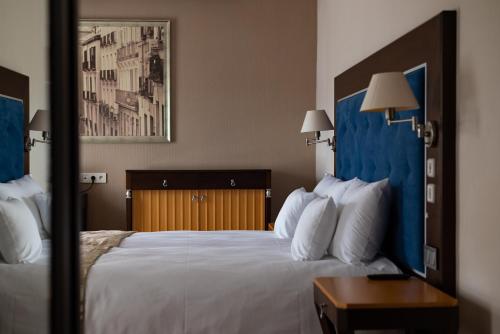 Cama o camas de una habitación en VillaGarden Dyplomat