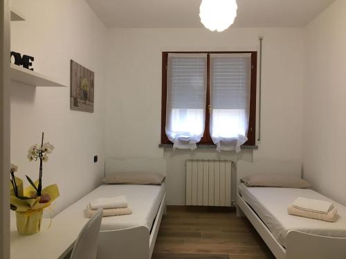 Кровать или кровати в номере Appartamento BELVEDERE