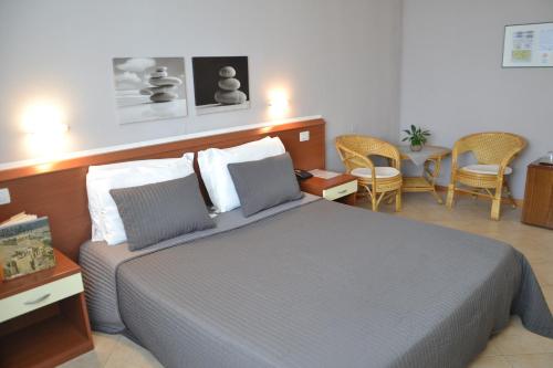 Postel nebo postele na pokoji v ubytování Hotel Petrarca