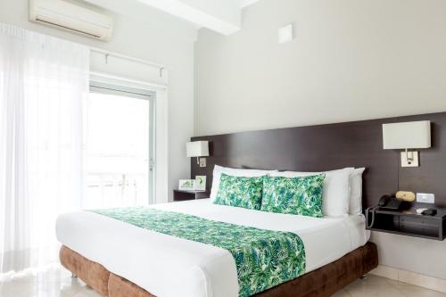 Postel nebo postele na pokoji v ubytování Hotel Manantial Melgar