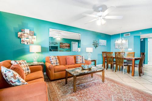 a living room with a couch and a table at Phoenix VI 206 in Orange Beach