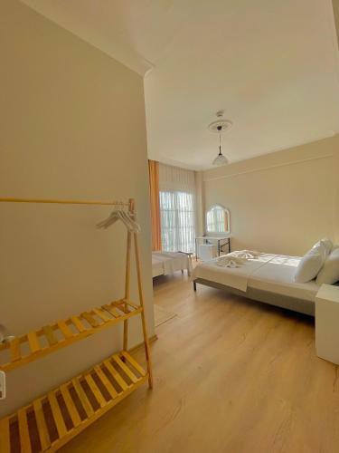 a bedroom with a bed and a staircase in it at Cennet Hotel in Fethiye