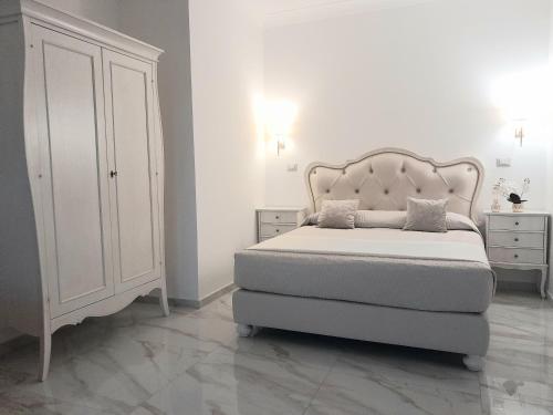 En eller flere senge i et værelse på La Vigna del Vento