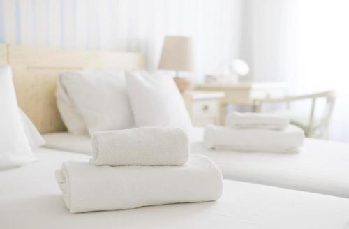 a pile of towels sitting on top of a room at Penzion Jakub in Lanškroun