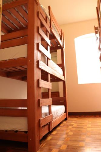 a bunk bed room with two bunk beds at Nuh Hostel - Lourdes in Belo Horizonte