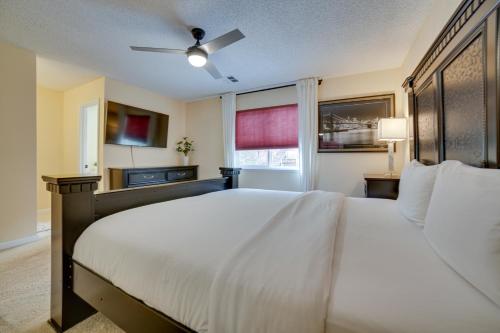 a bedroom with a large bed and a window at Reno Getaway with Spacious Patio and Grill! in Reno