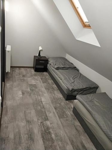 Postel nebo postele na pokoji v ubytování Przystanek Rozkochów