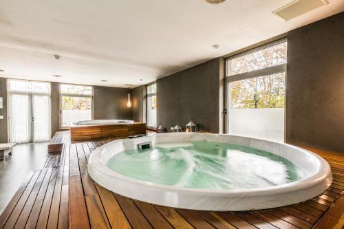 a large bathroom with a large tub in the middle at Trendy Apartment in Puerto Madero in Buenos Aires