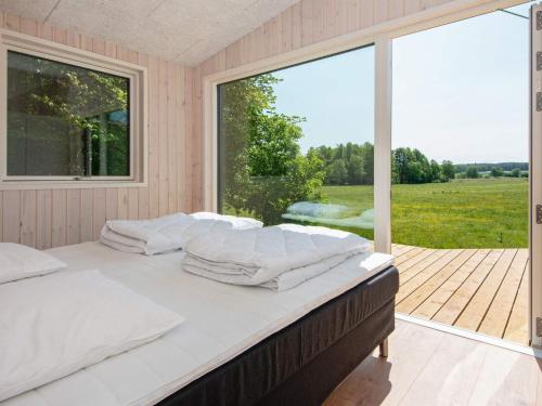 Postel nebo postele na pokoji v ubytování Holiday home Glesborg LXXXIX