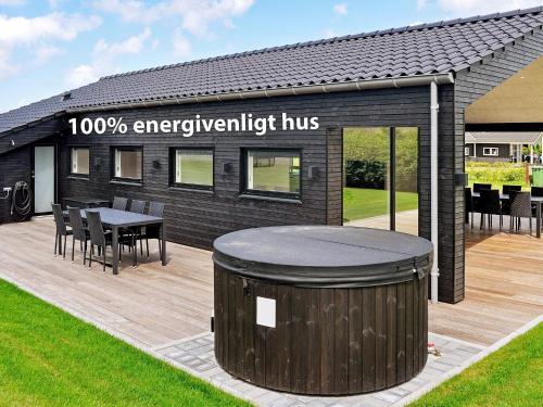 a building with a trash can in front of it at 6 person holiday home in Lemvig-By Traum in Lemvig