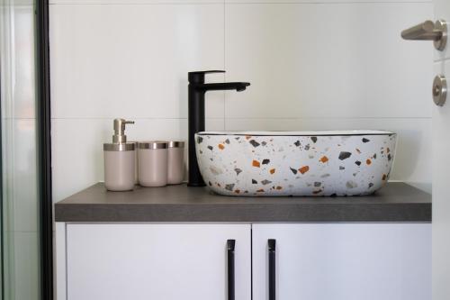 a bath tub sitting on top of a counter in a bathroom at Villa Koraljka in Vodice