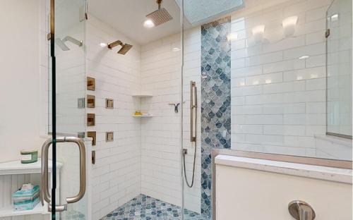 a shower with a glass door in a bathroom at Karoll I Unit D in Ocean City