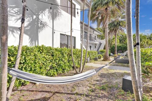 a hammock in front of a building at Waves On Walnut - Beach Access in Hollywood