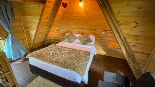 Una cama o camas en una habitación de Glamping Magic Love