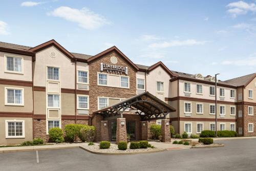 a rendering of the front of a hotel with a parking lot at Staybridge Suites Fort Wayne by IHG in Fort Wayne