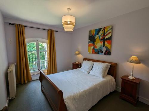 a bedroom with a bed and a window at Gîte Chadurie, 4 pièces, 4 personnes - FR-1-653-233 in Chadurie