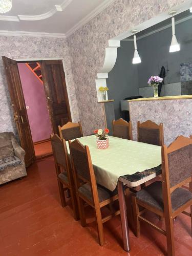 a dining room with a table and some chairs at LeriMari in Mestia